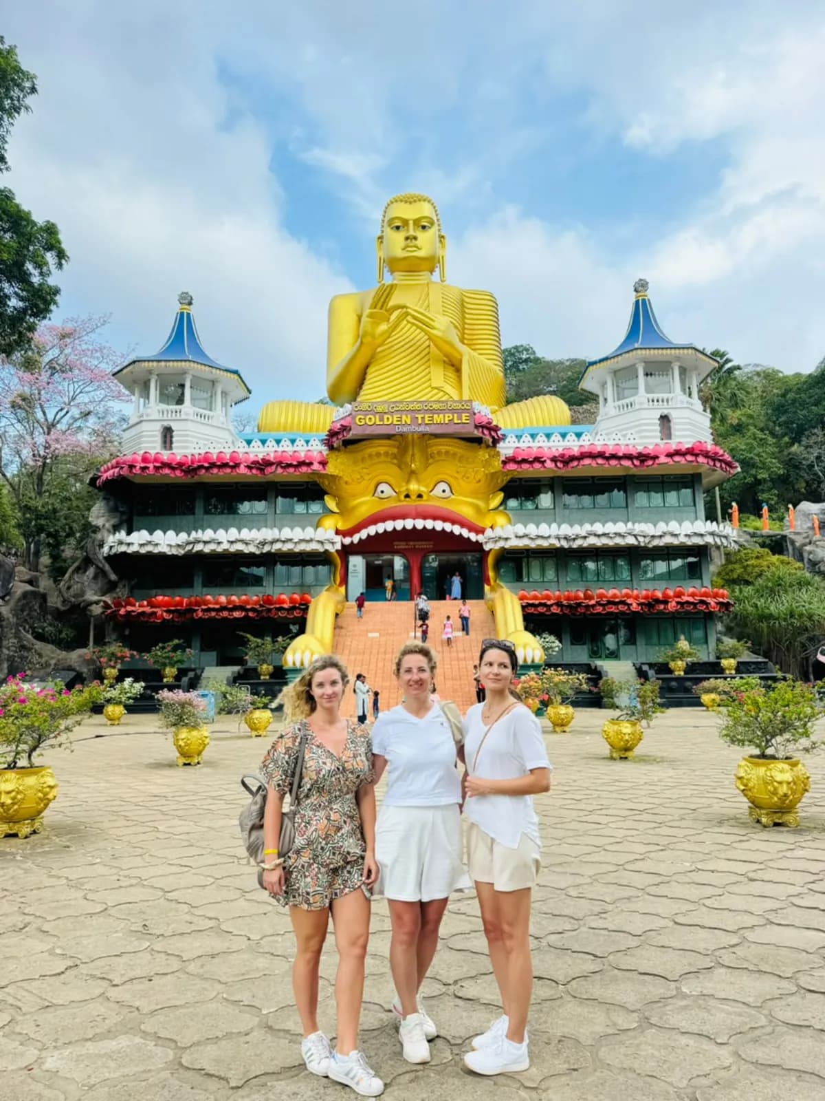 Three travellers in front of the Dambulla Golden Temple