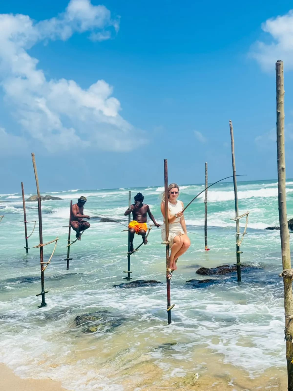 A traveller trying stilt fishing alongside local fishermen